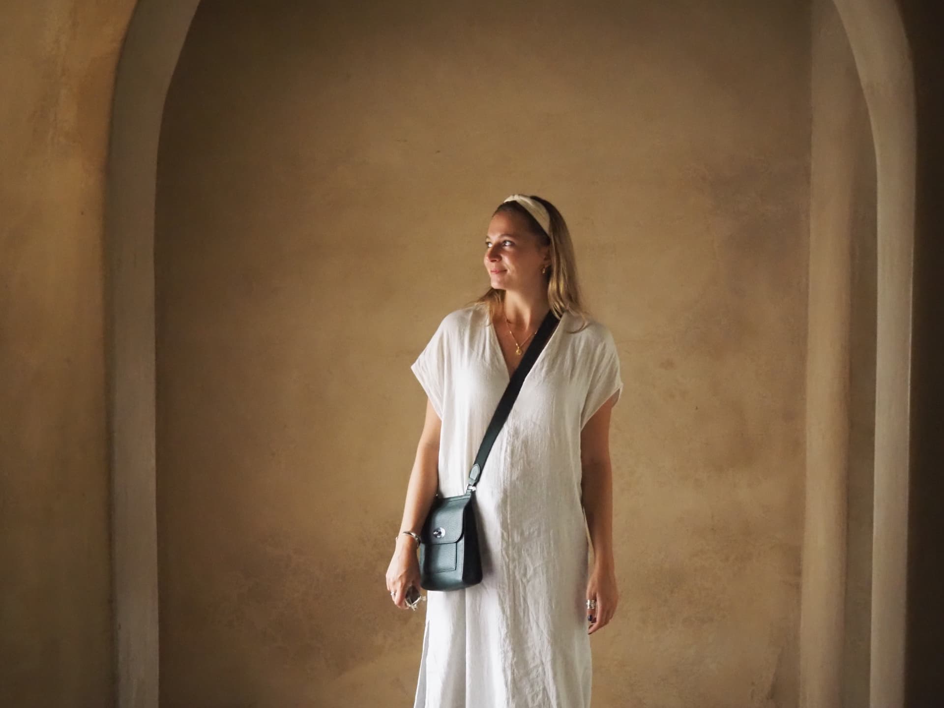 Chloë Garland standing beneath an archway