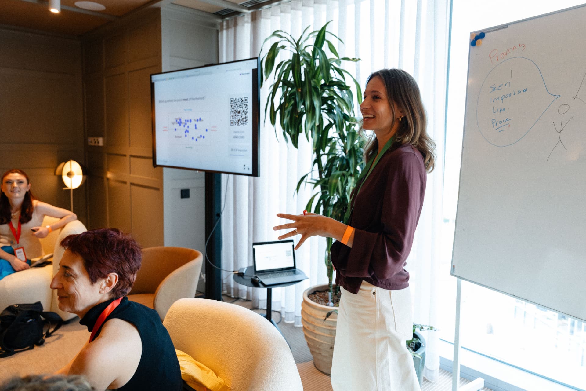 Chloë leading a workshop at a whiteboard
